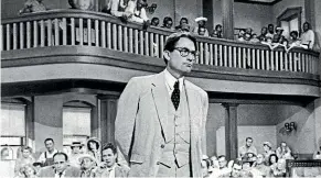  ??  ?? Gregory Peck is shown as attorney Atticus Finch, a small-town Southern lawyer who defends a black man accused of rape, in a scene from the 1962 movie To Kill a Mockingbir­d.