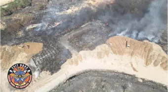  ?? Sabah State Fire and Rescue Department. — Photo from the ?? An aerial view at the Kayu Madang Landfill near the Kota Kinabalu Industrial Park in Telipok.