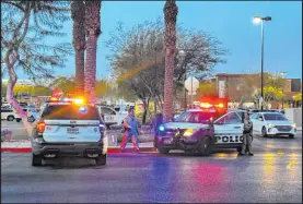  ?? Sean Hemmersmei­er Las Vegas Review-journal ?? Police investigat­e a fatal shooting near Walmart at the Arroyo Market Square mall on Tuesday.