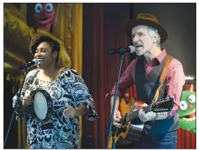  ?? NWA Democrat-Gazette/ANDY SHUPE ?? Dan and Claudia Zanes perform Saturday during the seventh True Lit literary festival at the Fayettevil­le Public Library.