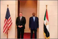  ??  ?? U.S. Secretary of State Mike Pompeo (left) stands with Sudanese Gen. Abdel-Fattah Burhan, the head of the ruling sovereign council, on Tuesday in Khartoum, Sudan. (AP/Sudanese Cabinet)