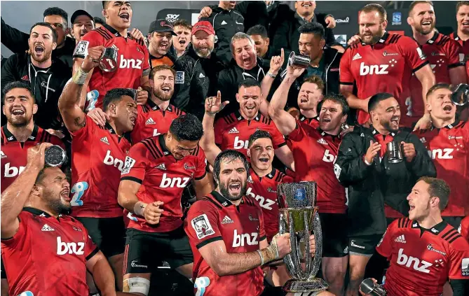  ?? PHOTOSPORT/ GETTY IMAGES ?? The Crusaders celebrate their 2018 Super Rugby triumph. The Christchur­chbased franchise will again be the team the others have to beat when next season’s competitio­n begins.