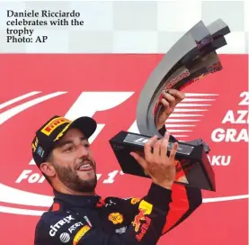  ??  ?? Daniele Ricciardo celebrates with the trophy Photo: AP