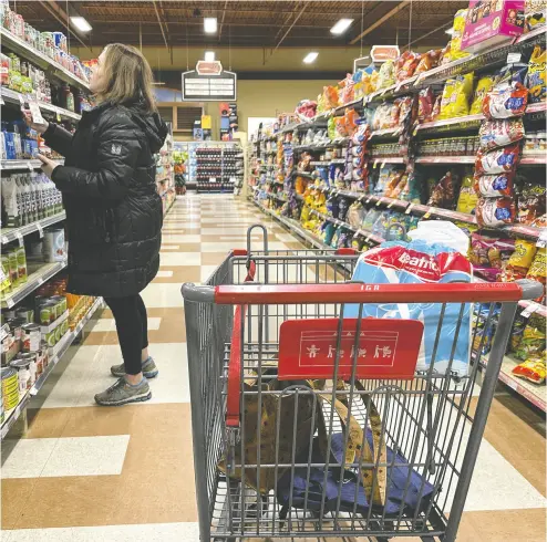  ?? CHRISTINNE MUSCHI / THE CANADIAN PRESS ?? Without all major players on board, the voluntary Canadian grocery code won’t work, advocates and politician­s say.