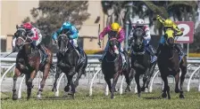  ?? Picture: JERAD WILLIAMS ?? Mr Dumont (far left, red cap), ridden by jockey Luke Rolls, takes out Race 1