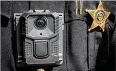  ??  ?? The Montgomery County Sheriff’s Office will equip deputies with body cameras as shown on Deputy Herman Dixon.