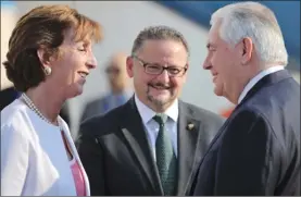  ?? The Associated Press ?? U.S. Secretary of State Rex Tillerson, right, is welcomed by U.S. ambassador Roberta Jacobson, left, and Mauricio Ibarra, director of North American affairs at the Mexican foreign affairs ministry at the Benito Juarez internatio­nal Airport in Mexico...