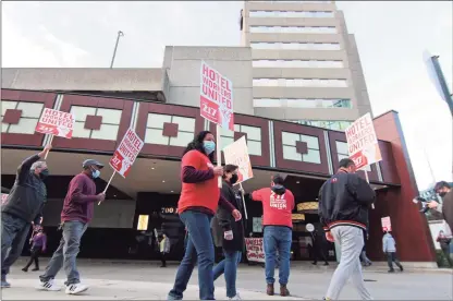  ?? Christian Abraham / Hearst Connecticu­t Media ?? Stamford Sheraton hotel employees and leaders of their union, Local 217 Unite Here, hold a rally to protest its closing outside the hotel in downtown Stamford on Wednesday.