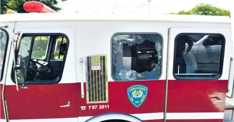  ??  ?? Windows of a re engine were shattered by rocks thrown during the protests at UniZulu