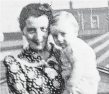  ??  ?? Phyllis Cooper holds her youngest sibling, Richard Gulliver, around 1942.