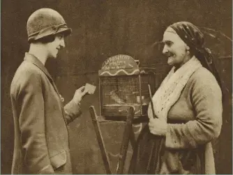  ??  ?? Bird’s eye view
An old woman with a ‘fortune-telling’ parakeet in 1920s London. Those who questioned science and reason in postwar Britain were “tuning into an important popular zeitgeist”