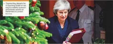  ?? Bloomberg ?? Theresa May departs No 10 Downing Street on her way to a weekly question and answer session at Parliament in London.