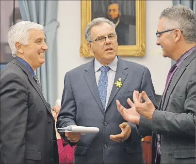  ?? MAUREEN COULTER/THE GUARDIAN ?? Opposition MLA Colin LaVie, centre, gave Premier Wade MacLauchla­n a grade of D on his report card on the premier’s performanc­e since being elected on May 4, 2015. He is pictured here with Liberal MLAs Pat Murphy, left, and Heath MacDonald, right.