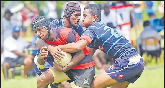  ?? Picture: JONA KONATACI ?? Wainimala Warriors player Jone Silimia attacks against Lelean Bati during the Vodafone Fiji Secondary Schools Rugby League competitio­n at the St Marcelin Primary School grounds in Vatuwaqa on Saturday.