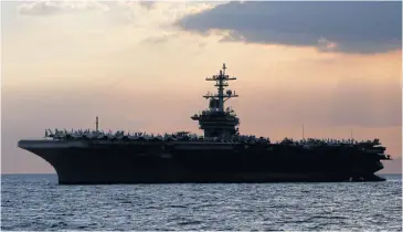  ?? AP ?? The US aircraft carrier ‘Theodore Roosevelt’ is anchored off Manila Bay to host top Philippine officials and businessme­n on April 13.