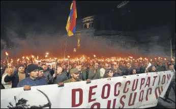  ?? AFP ?? Armenian opposition supporters march during an anti-Russia rally in Yerevan on Wednesday.