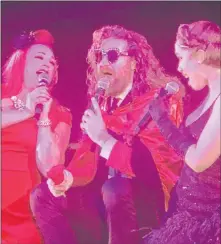  ?? John Katsilomet­es Las Vegas Review-journal @Johnnykats ?? Dani Armstrong, left, Casey Abrams and Jaclyn Mcspadden perform Saturday during the finale of “Postmodern Jukebox” at The Mirage.