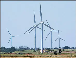  ?? AP file photo ?? Wind turbines are pictured near El Reno, Okla., last spring. Oklahoma has encouraged the growing wind-generation industry over the past 15 years with tax breaks and other incentives, but state budget deficits have prompted legislator­s to reverse...