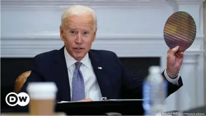  ??  ?? 'This is infrastruc­ture,' Biden told the CEOs, holding up a silicon wafer, a core component in making computer chips, imported in large part from Asia at present