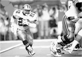  ?? SUSAN RAGAN/ASSOCIATED PRESS FILE PHOTO ?? Cowboys RB Emmitt Smith, a former Florida standout, rushed for 132 yards and 2 TDs en route to earning MVP honors as Dallas beat Buffalo 30-13 in Super Bowl XXVIII in Atlanta.
