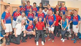  ??  ?? IN GOOD COMPANY: Dutchman Ricksen joins the Rangers Legends in their dressing room before kick-off in the charity Foundation match.