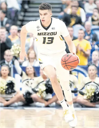  ??  ?? Michael Porter Jr of the Missouri Tigers dribbles the ball during a game this year.