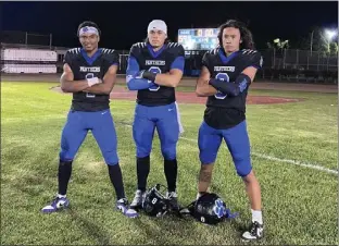  ?? PHOTO BY CRISTIAN VASQUEZ ?? Jordan rolled to a 59-24season-opening victory over North Torrance on Friday behind the play of running back Jordan Washington, from left, quarterbac­k Jarret Nielsen and wide receiver Jake Bautista.