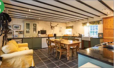  ?? ?? Period features abound in the cottage, including beamed ceilings (left) and restored pitch pine floorboard­s. There is also a large rear garden (below), with parkland and woodland grounds beyond