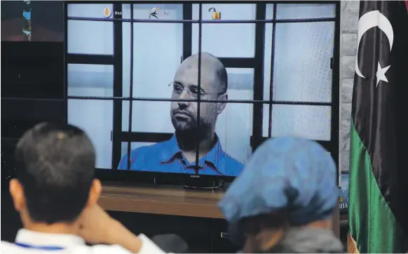  ?? AFP ?? The trial of Saif Al Islam, televised on April 27, 2014. He has not been publicly seen or heard of since that broadcast, when he appeared via video from the town of Zintan being questioned by judges at a court in Tripoli. The Internatio­nal Criminal...