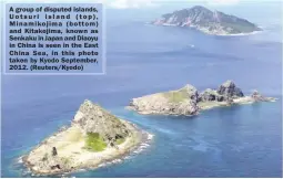  ??  ?? A group of disputed islands, Uotsuri island (top), Minamikoji­ma (bottom) and Kitakojima, known as Senkaku in Japan and Diaoyu in China is seen in the East China Sea, in this photo taken by Kyodo September, 2012. (Reuters/Kyodo)