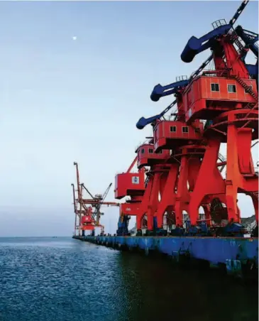  ??  ?? Cranes stand at the shore of the Gwadar port. The port can now accommodat­e two 50,000-ton container ships simultaneo­usly. courtesy of the CCCC