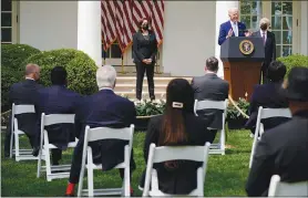  ?? ANDREW HARNIK / AP ?? President Joe Biden, f lanked by Vice President Kamala Harris and Attorney General Merrick Garland speaks about gun violence prevention Thursday in the Rose Garden at the White House.