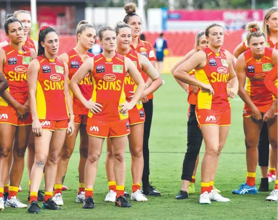  ?? Picture: AAP IMAGE ?? The emptiness of a draw is reflected on the faces of the Gold Coast Suns players after the inaugural AFLW QClash.