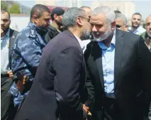  ??  ?? HAMAS CHIEF Ismail Haniyeh (right). His movement won 24 of 51 seats on Bir Zeit University’s student council.