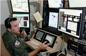  ??  ?? SELF SUFFICIENT
The U.S. military plans to include AI in autonomous Reapers and other weapons, including submarines and fighter jets. Top left to bottom right: An avionics specialist conducts preflight checks; an Air Force officer pilots a Reaper; ready on the tarmac at Creech Air Force Base in Nevada.