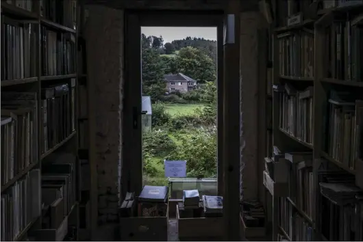  ?? Photo for The Washington Post by Virginie Nguyen Hoang/ Collectif Huma ?? La Librairie Ardennaise, one of the oldest bookstores in Redu, Belgium, has about 30,000 volumes. Owner Paul Brandeleer expects they’ll have to be tossed out when he retires.