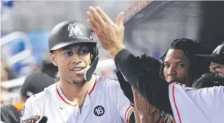  ?? Lynne Sladky, The Associated Press ?? Miami Marlins slugger Giancarlo Stanton has been involved in a high number of highfives this season.