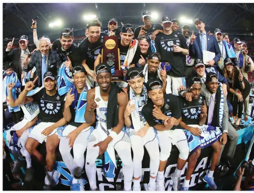  ??  ?? The North Carolina Tar Heels celebrate with the trophy after defeating the Gonzaga Bulldogs during the 2017 NCAA Men’s Final Four National Championsh­ip game at University of Phoenix Stadium on Monday in Glendale, Arizona. The Tar Heels defeated the...