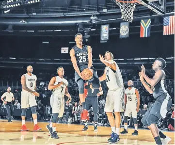  ??  ?? NBA player Thabo Sefolosha (centre) from the Philidelph­ia 76ers vies during the NBA Africa Game 2017 basketball match between Team Africa and Team World in Johannesbu­rg. — AFP photo