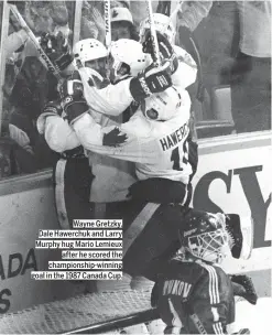  ??  ?? Wayne Gretzky, Dale Hawerchuk and Larry Murphy hug Mario Lemieux
after he scored the championsh­ip-winning goal in the 1987 Canada Cup.