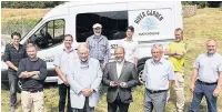  ??  ?? Driving forward Stephen Holmes and Jim Herbert present staff and volunteers at River Garden with the keys to a new van