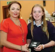  ??  ?? Sarah Ryan receiving the Kindness Award from her Teacher Moira O’ Connor.