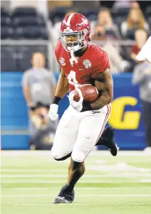  ?? MICHAEL AINSWORTH/AP ?? Alabama running back Brian Robinson Jr. runs during a College Football Playoff semifinal game last season. The Commanders selected Robinson in the third round with the 98th overall pick.