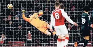  ??  ?? Arsenal’s goalkeeper Petr Cech is beaten by a shot from Manchester City’s Bernardo Silva during yesterday’s English Premier League match at the Emirates stadium in London.