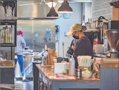  ?? CARLY STONE - MEDIANEWS GROUP ?? A look at the inside operations at the Pewter Spoon Cafe in Cazenovia. Guests can purchase items for takeout-only, and must order over the phone or online.