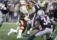  ?? CHARLES KRUPA — ASSOCIATED PRESS ?? Washington Redskins running back Rob Kelley runs from New England Patriots defensive back J.C. Jackson (34) during the first half of an Aug. 9 exhibition game in Foxborough, Mass.