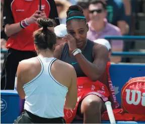  ?? CP PHOTO ?? Bianca Andreescu, left, speaks with Serena Williams after Williams withdrew from the Rogers Cup tennis final in Toronto on Sunday.