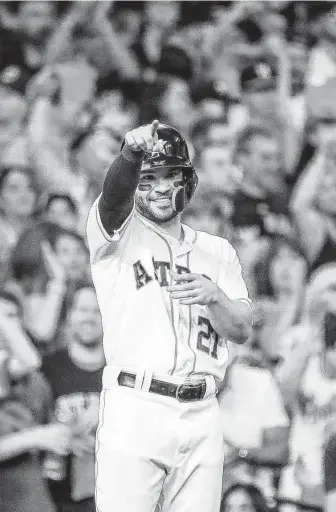  ?? Karen Warren / Staff photograph­er ?? Jose Altuve (27) had the Astros on point for a return the the World Series all night, with a double to go with his game-winning home run and three runs scored.