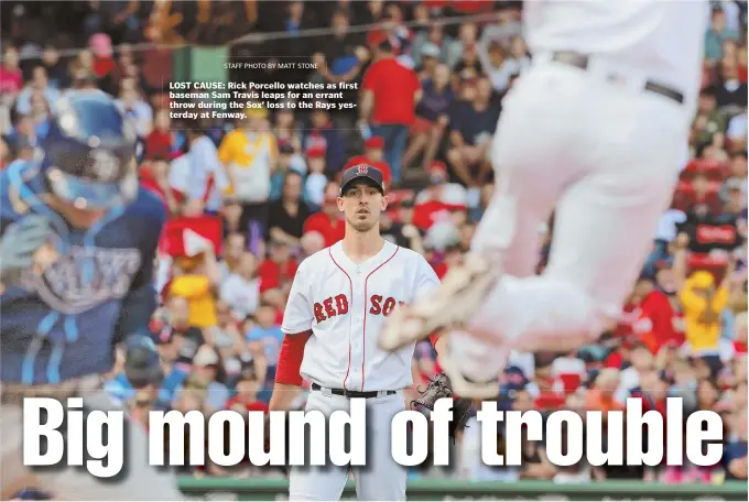  ?? STAFF PHOTO BY MATT STONE ?? LOST CAUSE: Rick Porcello watches as first baseman Sam Travis leaps for an errant throw during the Sox’ loss to the Rays yesterday at Fenway.
