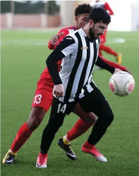  ??  ?? Rabat Ajax's Wayne Borg (R) in control against Pembroke Athleta. Photo: Domenic Aquilina